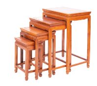 A Chinese stained hardwood quartetto nest of occasional tables,