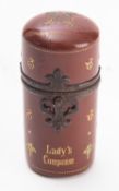 A Victorian 'Lady's Companion' tooled leather etui, late 19th century; of cylindrical form,