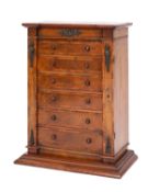 A Victorian walnut and crosbanded table top Wellington chest,