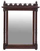 A Victorian carved oak wall mirror in Gothic taste,