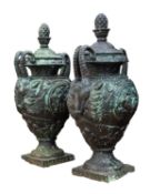 A pair of painted cast iron twin handled garden urns and covers,