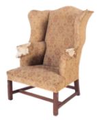 A stained beech wing frame armchair, in the Queen Anne taste,