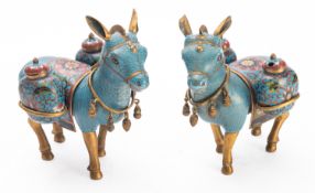 A pair of Chinese cloisonné donkey cruets each with two cruets and decorated with flowers and
