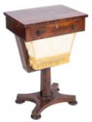A Regency rosewood work table, early 19th century; the drawer with twin turned knob handles,