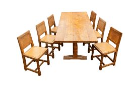 Workshop of Robert 'Mouseman' Thompson, a fine oak trestle dining table and six chairs en suite
