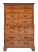 A George III mahogany chest on chest, circa 1800; with moulded and dentilled cornice,