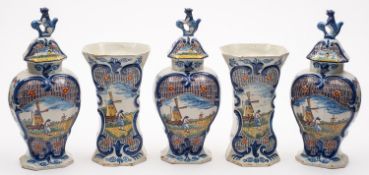 A garniture of Dutch Delft vases compromising of three vases and covers