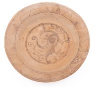 A Nishapur pottery bowl, of shallow everted form the centre painted with a bird amongst foliage,