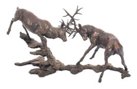 Richard Cooper & Company, Art in Bronze, a patinated bronze group of two rutting stags,