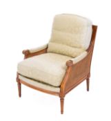 A mahogany canework and upholstered bergere chair in Regency style,