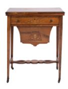 An Edwardian rosewood and marquetry games and work table,