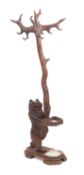 A 'Black Forest' carved and stained wood bear hall stand, probably Brienz,