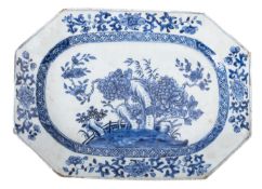 A Chinese porcelain meat dish of octagonal form and painted in blue with chrysanthemum and peony