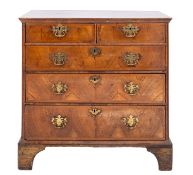 A George II Walnut and crossbanded chest of drawers,