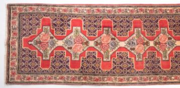 A Senneh runner, the rose stepped cruciform field with vases of roses,