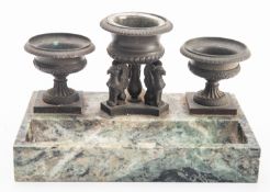 A patinated bronze and Connemara marble mounted standish, second quarter 19th century;
