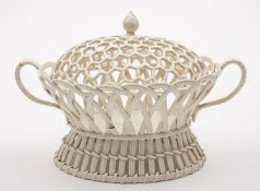 A cream ware openwork chestnut basket of two handled oval form with a matched cover,
