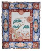 A Japanese Imari rectangular dish, decorated with a pair of cranes, a mountain in the background,