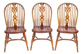 A set of five elm and oak Windsor elbow chairs,