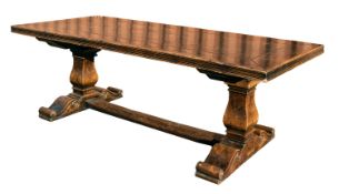 An oak trestle table,