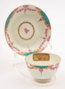 A First Period Worcester teabowl and saucer of semi-reeded form
