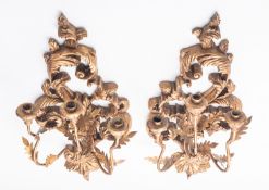A pair of gilt composition and metal mounted three light wall appliques, in 18th century taste,