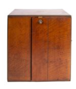 A Victorian oak and brass banded cigar cabinet, by the Army & Navy CSL,