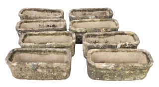 A set of eight stone composition planters, second half 20th century; of rectangular form,