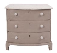 A pine bow front chest of drawers,