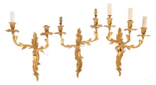 A set of three gilt metal wall appliques in Louis XV style,