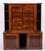 A Collector's Victorian rosewood cabinet/bookcase, of breakfront outline, on a cabinet base,