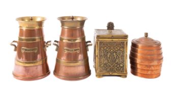 A pair of brass banded copper tea caddies modelled as milk churns.