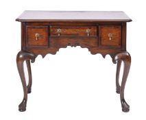 An oak and walnut banded 'lowboy' side table, in George II style,