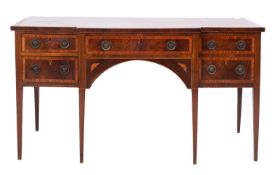 A George III mahogany breakfront sideboard, early 19th Century, the crossbanded and marquetry top,