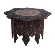 An Anglo Burmese carved hardwood and copper topped occasional or 'tiffin' table,