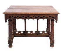 A Victorian oak centre table, in Gothic taste,