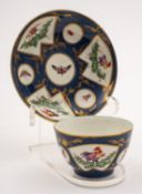 A First Period Worcester teabowl and saucer painted with fan-shaped and circular panels of fancy