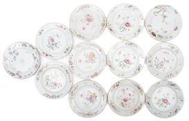 Twelve Chinese porcelain plates decorated in the famille rose palette variously with birds,