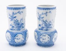 A pair of Japanese Arita blue and white vases, late Meiji period painted with quail,