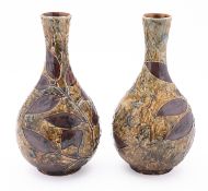 A pair of Royal Doulton natural foliage pattern baluster vases.