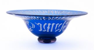 A blue glass caligraphic bowl. 26cm diam