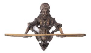 A wall hanging brass towel rack in form of female figure.