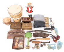 A leather skinned wooden drum and carved