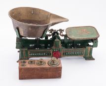 A cast iron set of scales. Painted green