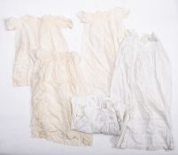 A collection of christening gowns. All i