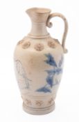 A blue glazed stoneware jug. Showing an