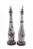 A pair of ceramic table lamps. Having fl