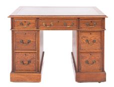 An oak pedestal desk in Regency style,