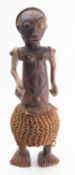 An African carved hardwood figure, possi