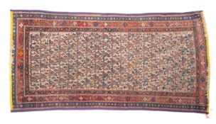A Hamadan rug, the ivory field with an all over boteh and arrowhead design,